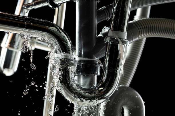 istock There is leak in water pipe under the sink, drain is clogged. Water Leak around pipe because sink is draining slowly and splashing with many pipes 2196899329