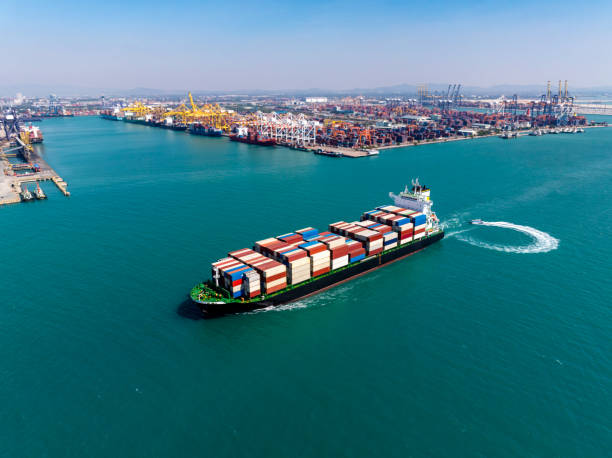 istock cargo logistic container ship sailing in sea, import export goods and distributing products to dealer and consumers across worldwide, container shiping service  concept. 2196899429