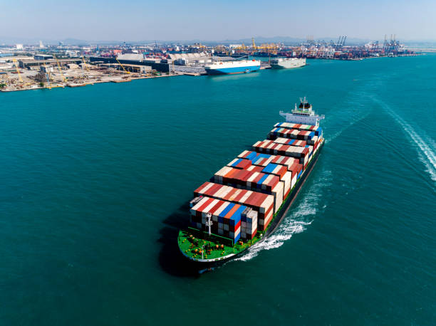 istock cargo logistic container ship sailing in sea, import export goods and distributing products to dealer and consumers across worldwide, container shiping service  concept. 2196899434