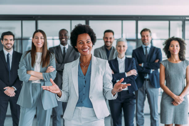 istock Confident businesswoman and her team. 2196901173