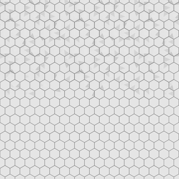 Hexagonal tiles in gray and white form a geometric pattern suited for walls or floors. Designed for interior spaces, this layout presents a clean and modern aesthetic.
