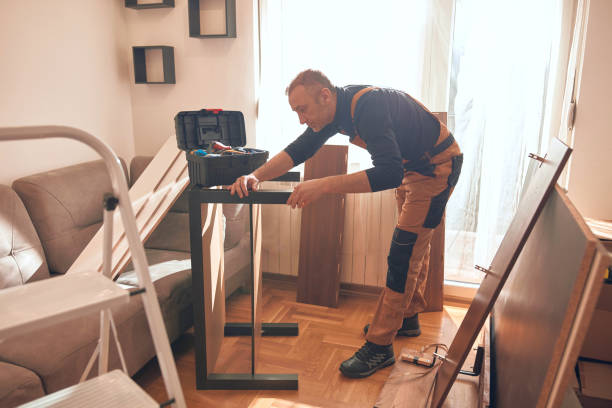 istock Carpenter working and assembling furniture in a new apartment. 2196902864