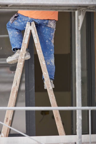 istock Repairman working on a new building facade. 2196903739