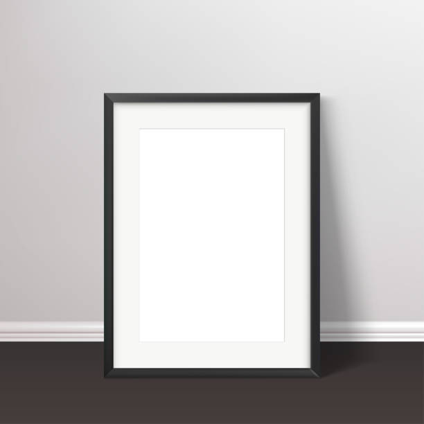 istock Wall poster realistic mockup. Black frame standing on the floor with passepartou mock up. Vector illustration. 2196904123