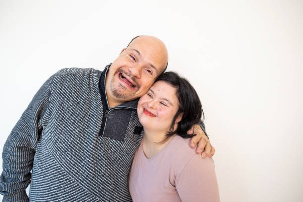 istock Smiling embracing couple with down syndrome 2196904460