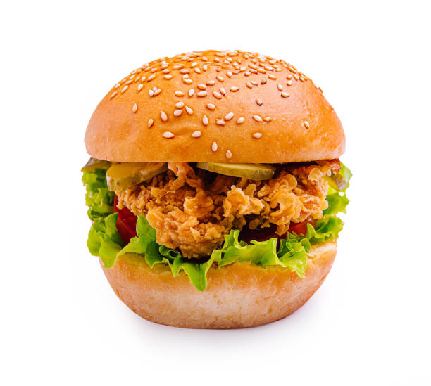 istock Delicious sesame seed burger with crispy chicken, fresh vegetables, and vibrant toppings for a tasty meal 2196906410
