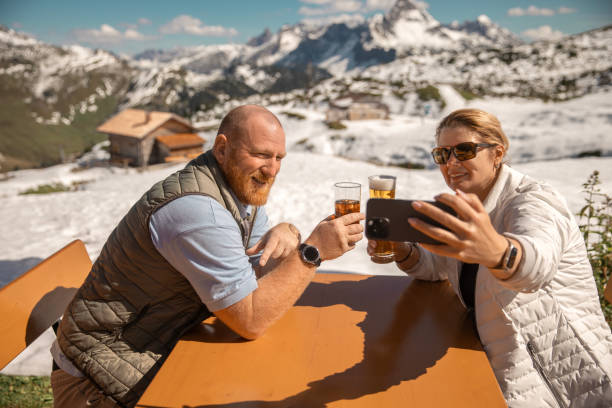 istock Two senior hikers resting at a cafe in the outdoors on an Austrian european staycation 2196907478