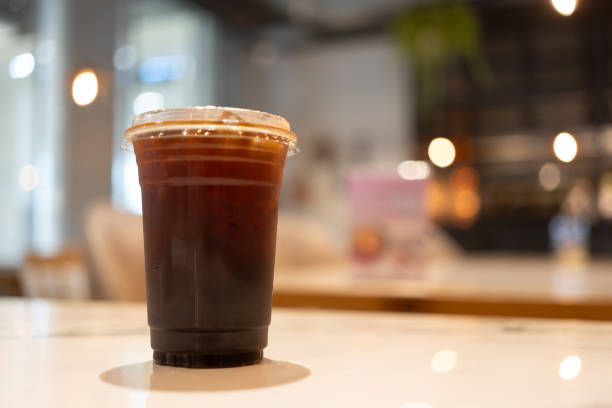 istock Black coffee with ice in a take away glass at cafe. 2196908752