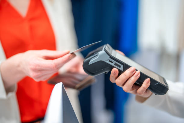 istock Customer Payment at Boutique with Credit Card Reader 2196911180