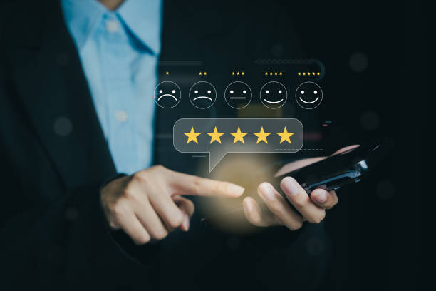 istock Person using smartphone for feedback with star ratings and emoticons 2196916166