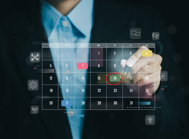istock Businessman marking date on digital calendar interface 2196916171