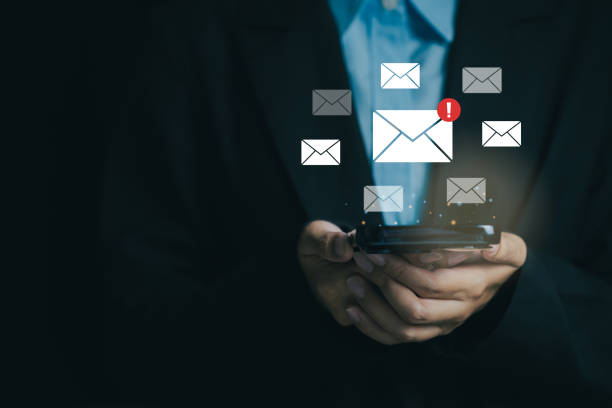 istock Person holding smartphone with email notifications concept 2196916177