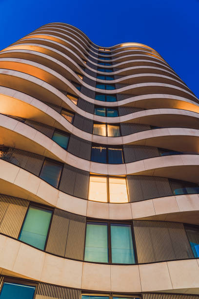 Modern skyscraper with balconies reaching for the sky in vauxhall, london, showcasing contemporary architecture