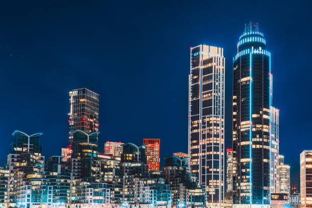 Illuminated skyscrapers dominating the vauxhall skyline at night, showcasing london's modern architecture