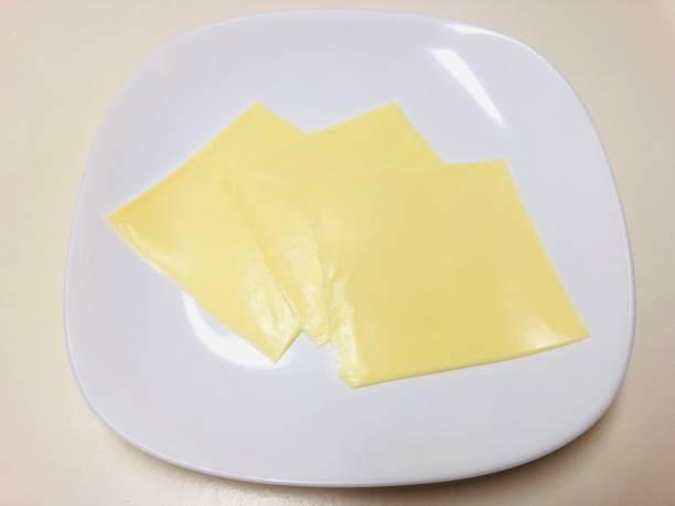 istock 3 slices of cheese on a plate 2196917929
