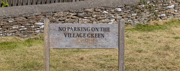 istock Rustic No Parking on Village Green sign 2196921835