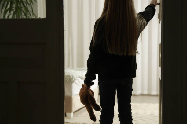 istock Lonely neglected child alone at home, looking for parents. 2196926497