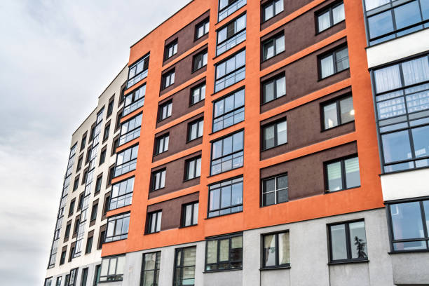 istock Modern apartment building facade with colorful accents and windows 2196926558