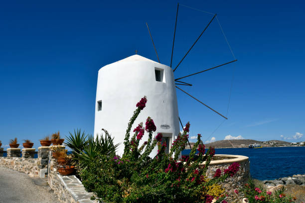 Paros, Greece - September 17, 2024: Old windmill now used as a cafe and bar in the town of Parikia