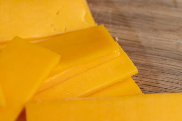 istock slicing yellow cheese close-up 2196928129
