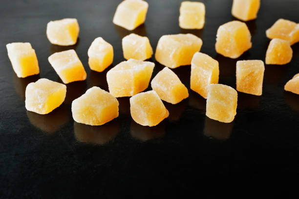 Traditional candies of candied ginger root , yellow  spicy taste bonbon useful to support and stimulate the stomach
