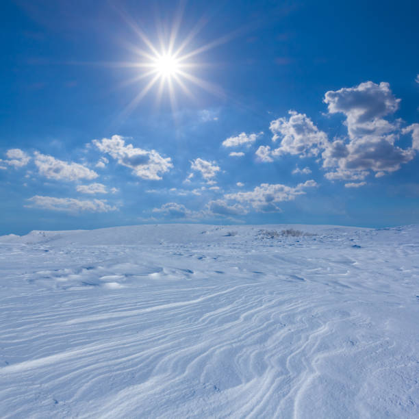 istock mountain ridge in snow under a sparkle sun 2196929209