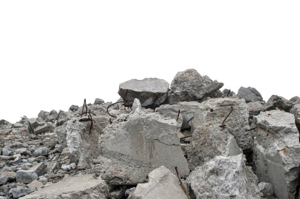 istock Pile of broken concrete rubble with exposed rusty metal rods isolated on a white background. Selective focus. 2196929268