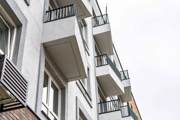 istock Brick building facade with balconies under cloudy sky 2196931145