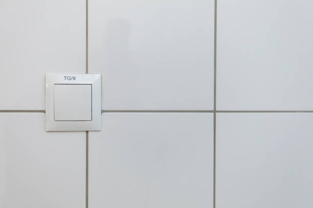 istock A clean white wall featuring a switch plate accentuates a minimalist and modern design 2196933244