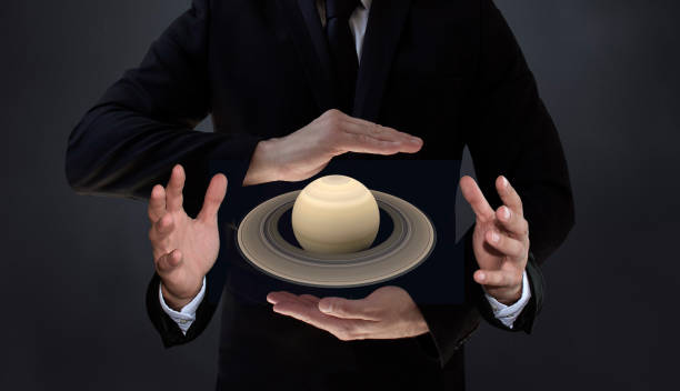 Space Research by New Artificial Intelligence Technology Humans who control AI-based systems will have more control over the structure of the Saturn. An AI-powered scientist holding a spinning planet Saturn ring in four hands. / You can see the animation movie of this image from my iStock video portfolio. Video number: 2194760347 finger spinning globe stock pictures, royalty-free photos & images
