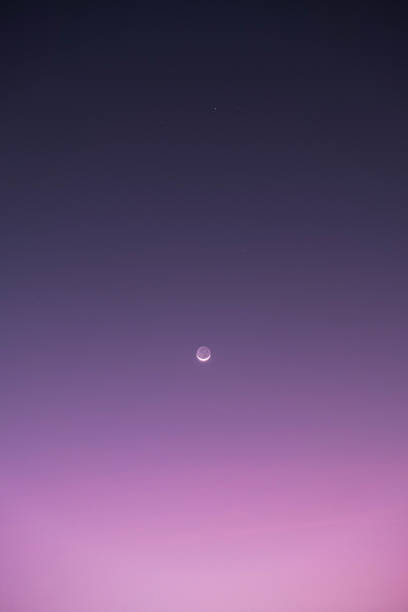 istock Crescent Moon and Saturn in evening sky 2196934478