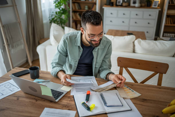 istock Designer deep in thought, selecting hues in his workspace 2196935660