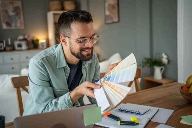 istock Designer selecting colors from a palette in a creative home office 2196935785