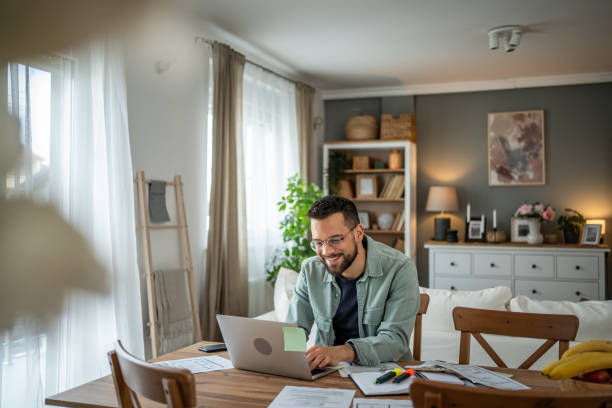 istock Freelancer enjoying the flexibility of remote work in his home office 2196935898