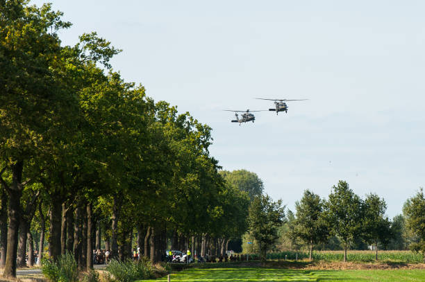 Two US Air Force Sikorsky UH-60 Black Hawks from the 101st Airborne Division arriving at the scene of an air attack demonstration commemorating Operation Market Garden in The Netherlands.