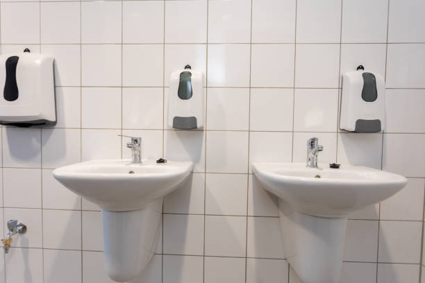 istock Thoroughly Clean and Maintain Modern Restroom Sinks to Ensure Hygiene and Comfort 2196936090