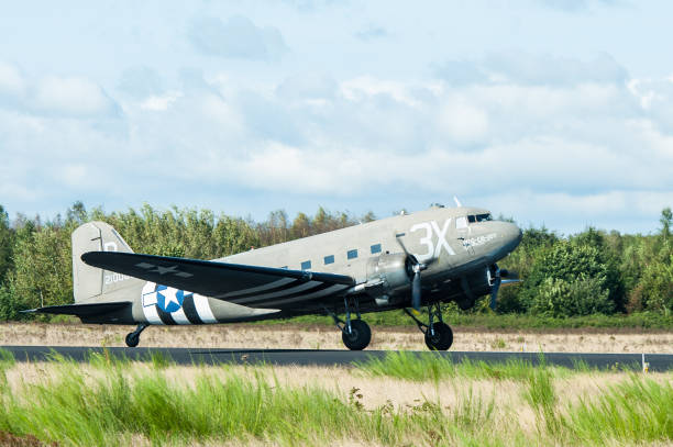 A Douglas C-47 Skytrain in US Air Force colors taking off from Eindhoven Air Force Base. The plane carries parachutists that will be dropped near Arnhem commemorating WW2 Operation Market Garden.