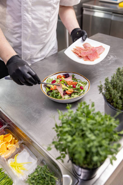 istock Chef preparing a healthy salad 2196936163