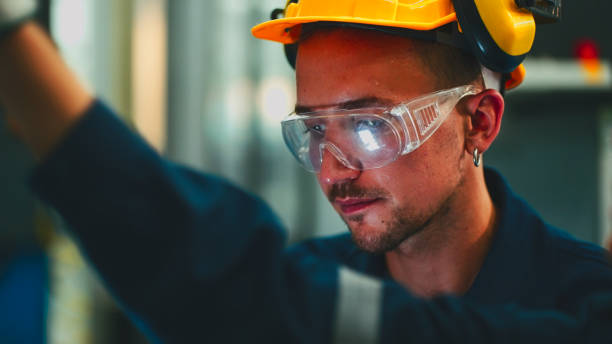 istock Male Engineers Maintenance Robot Arm  in laboratory. 2196936651