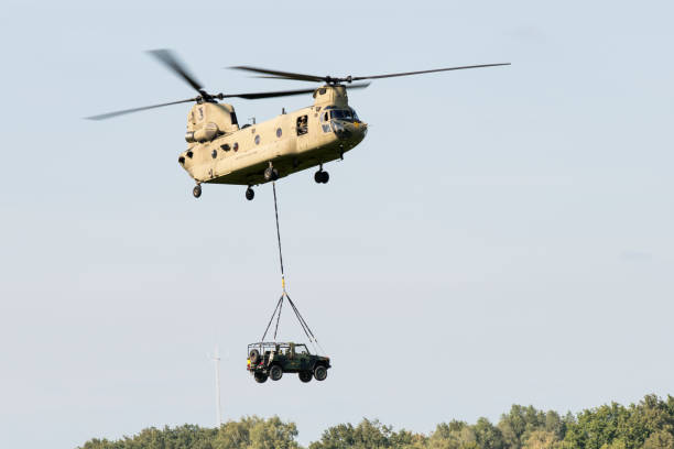 A US Air Force Boeing CH-47 Chinook from the 101st Airborne Division delivers a combat vehicle for an air attack demonstration commemorating Operation Market Garden in The Netherlands