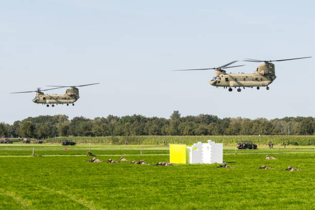 Two US Air Force Boeing CH-47 Chinooks from the 101st Airborne Division delivering combat vehicles for an air attack demonstration commemorating Operation Market Garden in The Netherlands