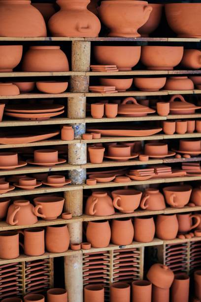 istock Handcrafted Terracotta Pottery on Shelves 2196936940