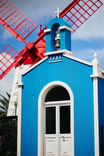 Colorful chapel and windmill scene
