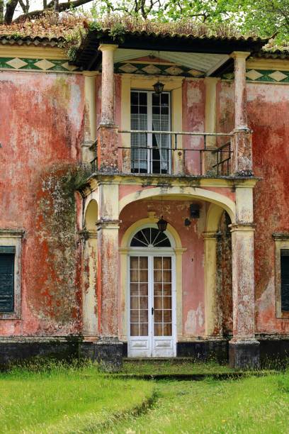 istock Weathered vintage facade with rustic door and balcony. 2196937306