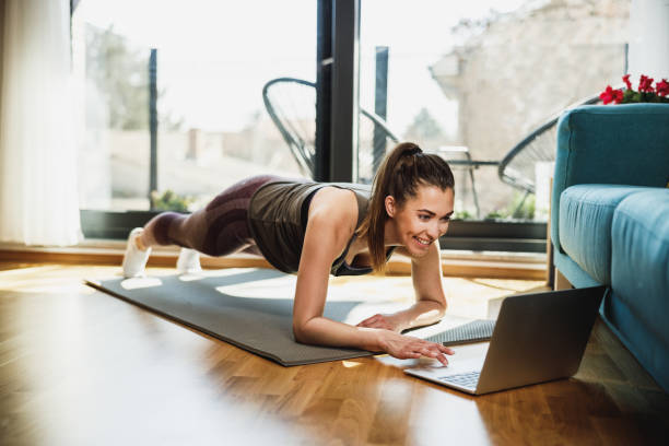 istock Woman Doing Online Workout At Home 2196938036