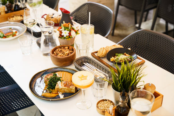 istock Outdoor brunch table setup with diverse dishes and drinks 2196939040