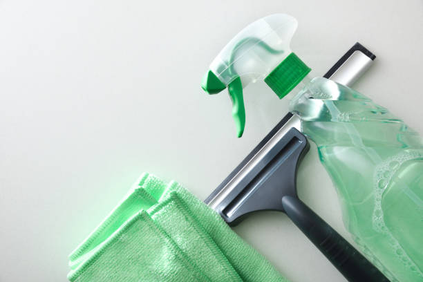 Window cleaner spatula, spray product and microfibre cloth isolated