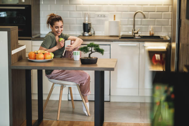 istock Woman Using Smartphone In The Morning At Home 2196939568