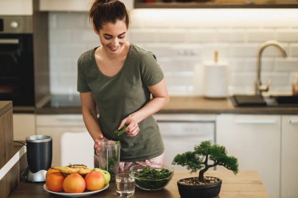 istock Woman Making A Healthy Smoothie At Home 2196939634