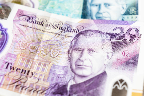 King Charles on British banknotes London, UK - A portrait of King Charles on twenty pound and five pound notes. british currency stock pictures, royalty-free photos & images